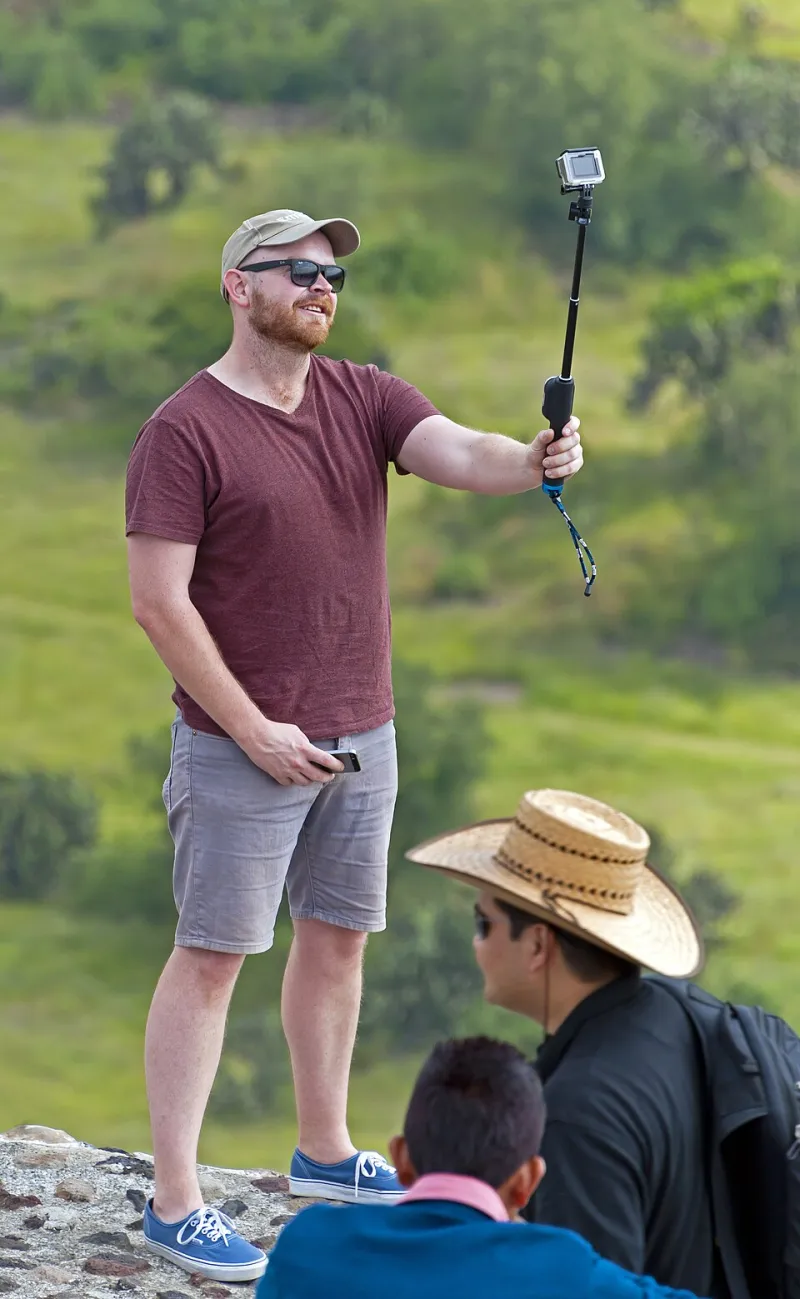 Arm's Length from Reality: How the Selfie Stick Taught Americans to Inhabit Their Own Lives as Spectators
